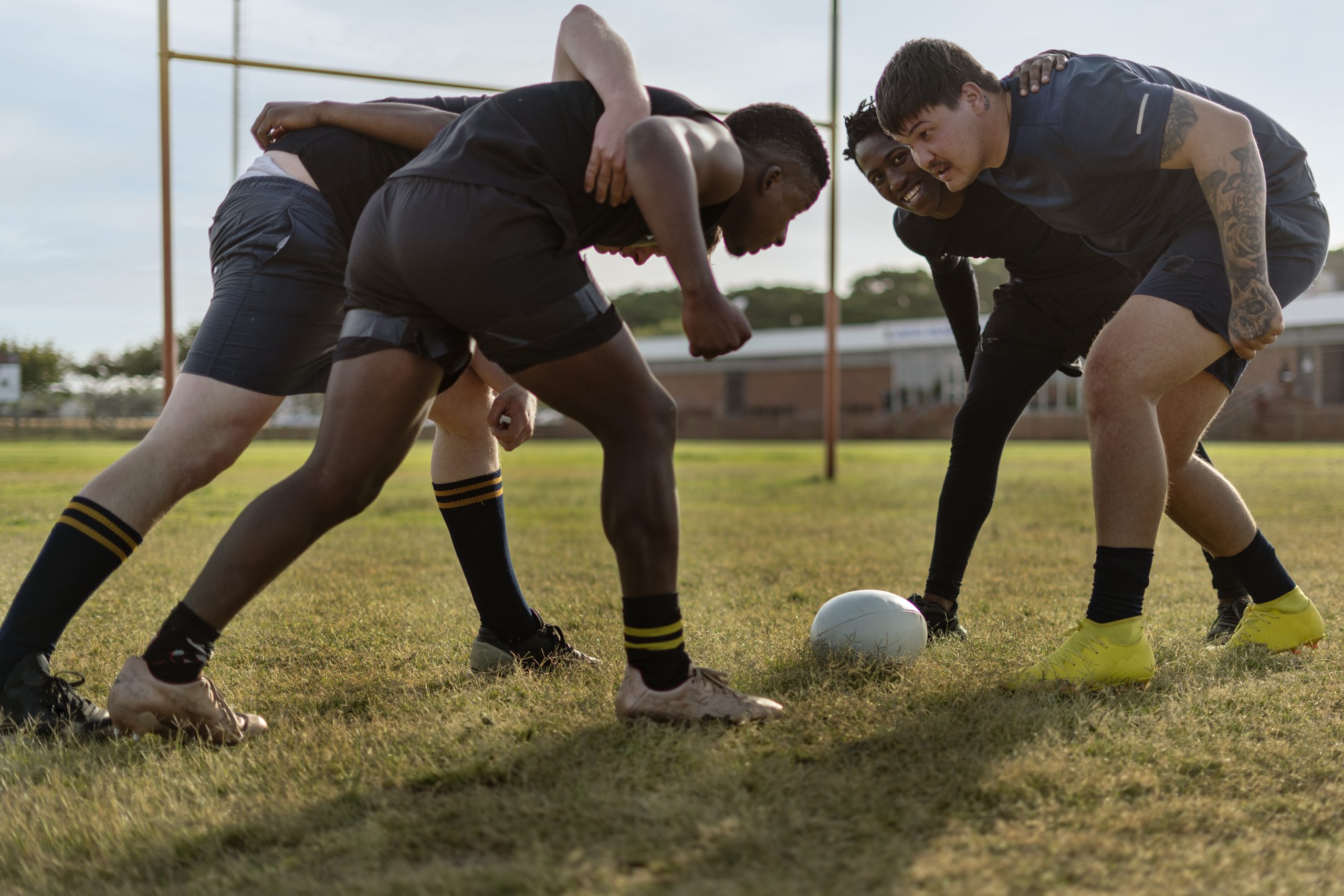 men-playing-rugby-field